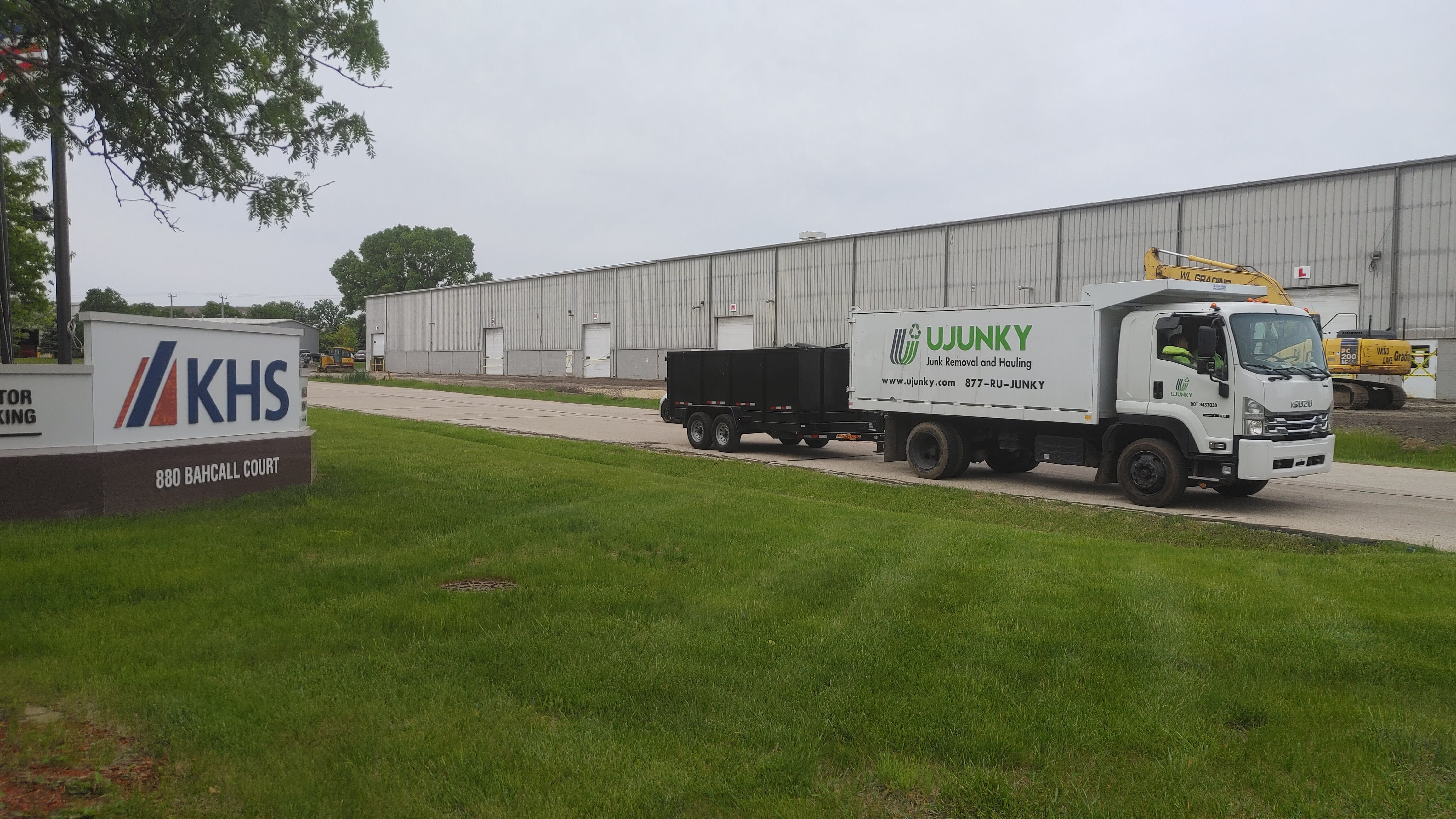 UJUNKY junk removal truck loading bulky items in Waukesha